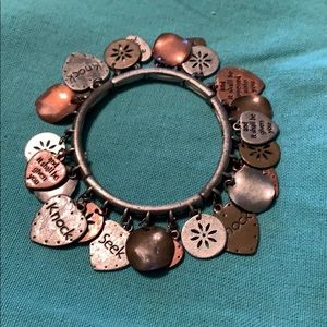 Copper, brass and silver toned charm bracelet.